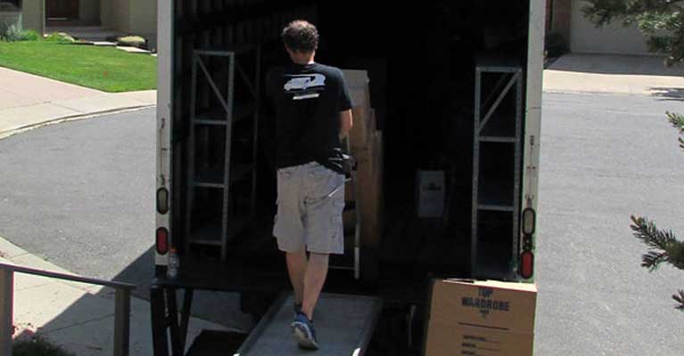 Crew loading boxes onto truck